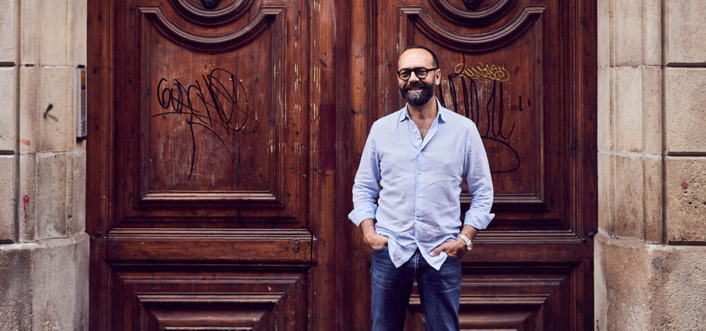 José Pizarro in front of large wooden doors