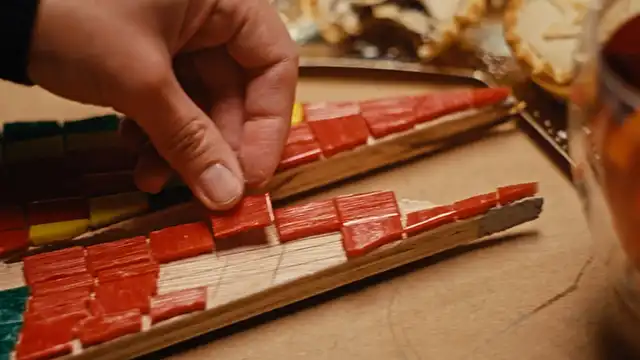 Close up of mosaic tiles being applied