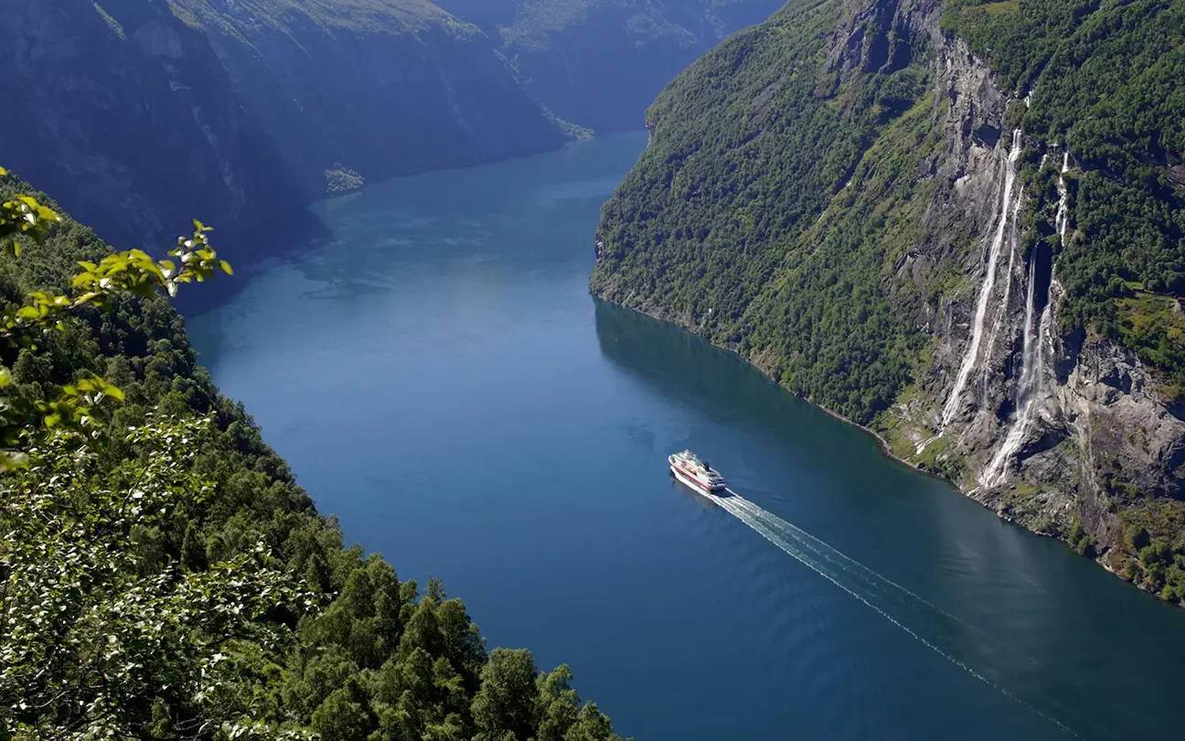 P&O Cruises' ship sailing up a fjord