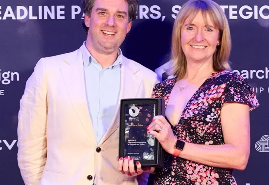 Tim Stafford and Steph Hill with the trophy from the Memcom Excellence Awards