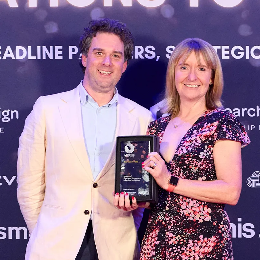 Tim Stafford and Steph Hill with the trophy from the Memcom Excellence Awards